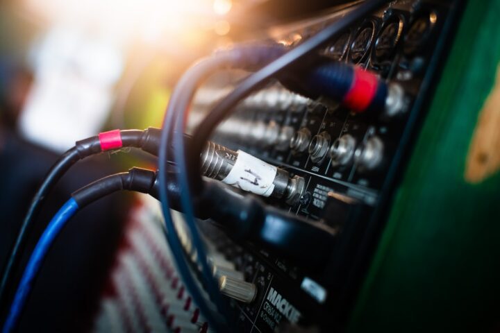 Cables plugged into studio equipment