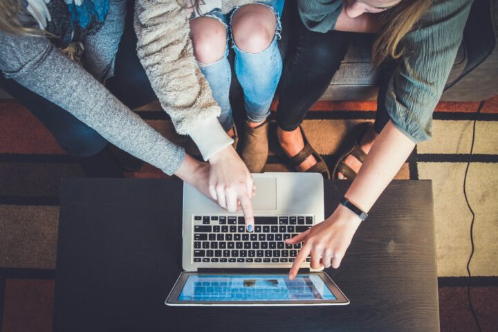 People sitting at laptop