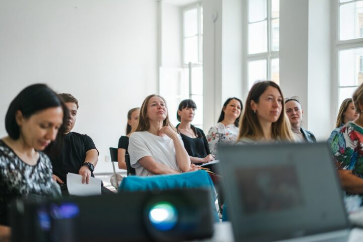 Group of people sitting at a lecture