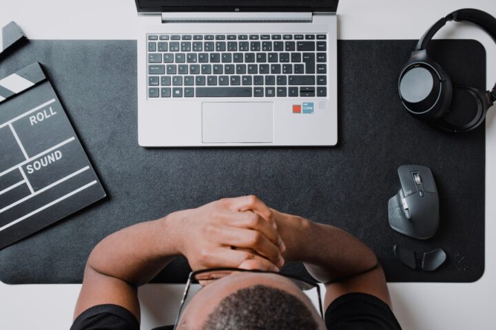 man-thinking-in-front-of-laptop